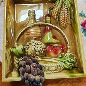 ceramic wall hanging wine with grapes. Small chip on top seen in pic